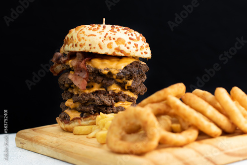 Burger cheese with potato in wooden table and black backgournd  photo