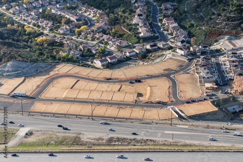 Aerial of view of graded dirt lots ready for new tract home construction in Los Angeles County California.