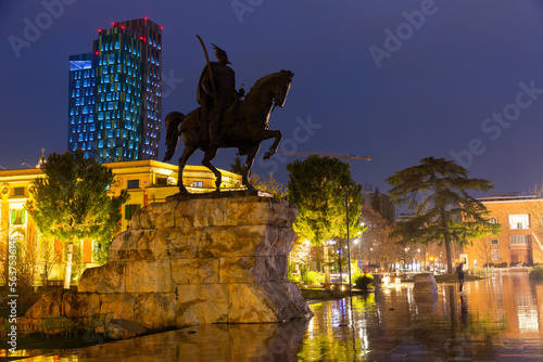 Statue of Albanian national hero, Gjergj Kastrioti, on Skanderbeg Square in Tirana in evening.