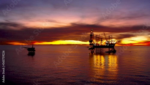 Aerial view of offshore jack up drilling rig during sunset - oil and gas industry
