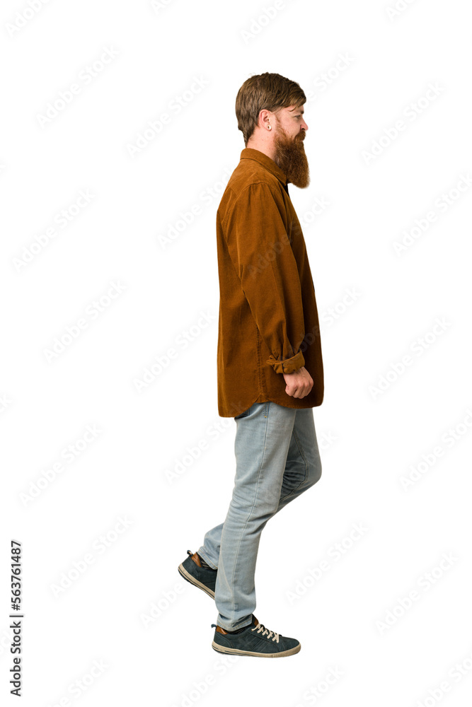 Fototapeta premium Adult redhead man walking cut out isolated