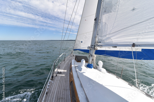 Great view on a fast moving white sailboat 