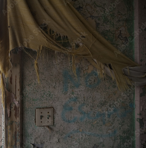 Canvas Print A dark, abandoned wall with a tattered curtain