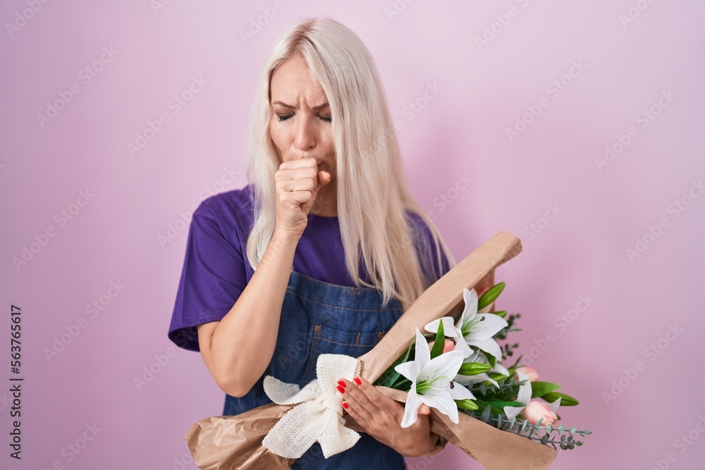 Caucasian woman holding bouquet of white flowers feeling unwell and coughing as symptom for cold or bronchitis. health care concept.