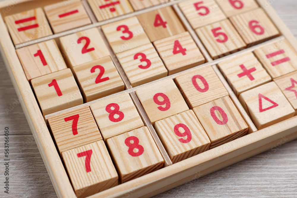 Math game with numbers on white wooden table, closeup Math game with numbers on white wooden table, closeup