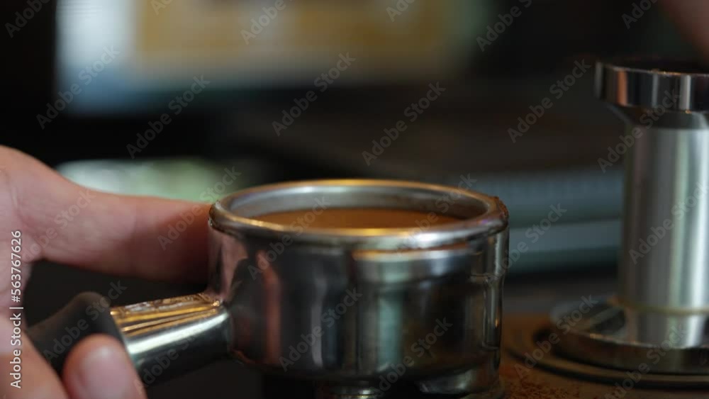 4K Asian man barista making hot espresso shot from coffee maker machine on counter at cafe. Coffee shop owner brewing black coffee serving to customer. Small business restaurant food and drink concept 4K Asian man barista making hot espresso shot from coffee maker machine on counter at cafe. Coffee shop owner brewing black coffee serving to customer. Small business restaurant food and drink concept