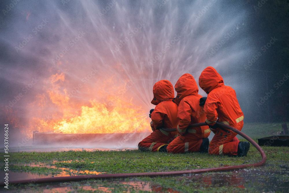 Firefighter Rescue training in fire fighting extinguisher. Firefighter