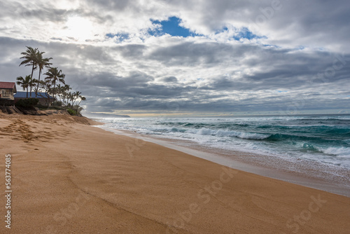 Waves crashing on the shore of Sunset Beach on the North Shore of Oahu, Hawaii photo