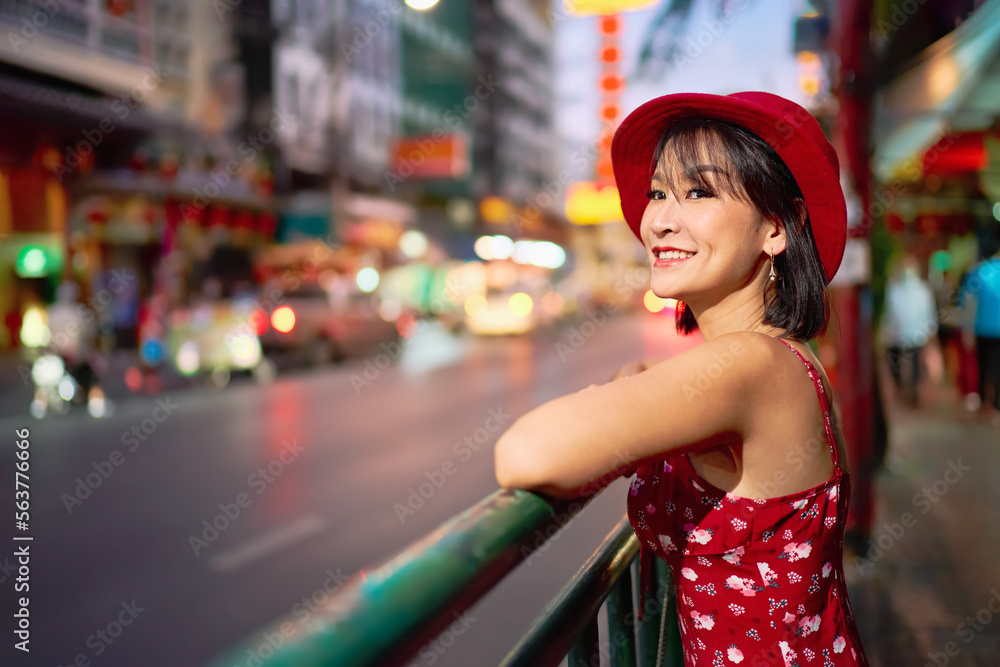 thai woman in red dress and hat visiting yaowarat chinatown bangkok thailand