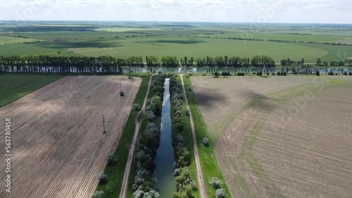 Beautiful and unusual landscape. It is a tributary of the river. Parallel roads. Fields. Propulsion. High quality aerial FullHD footage