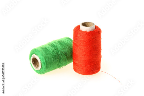 spools of thread for the textile industry on white background