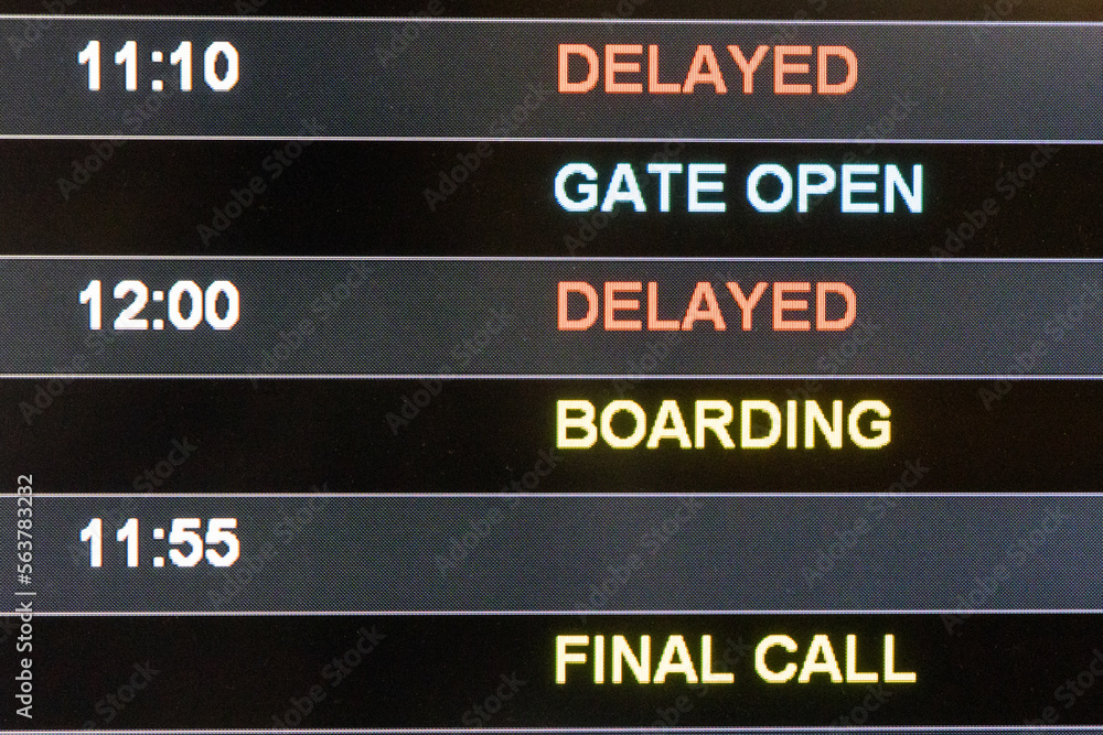 Close-up on airport flight information digital board with focus on word Delayed, Gate Open, Boarding and Final Call Close-up on airport flight information digital board with focus on word Delayed, Gate Open, Boarding and Final Call