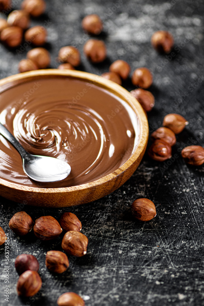 Hazelnut butter in a plate with a spoon. Hazelnut butter in a plate with a spoon.