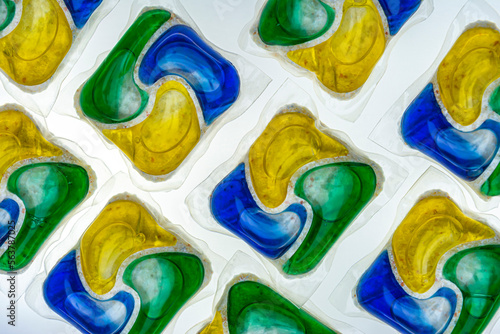 Background of different capsules with washing powder and soap for the washing machine
