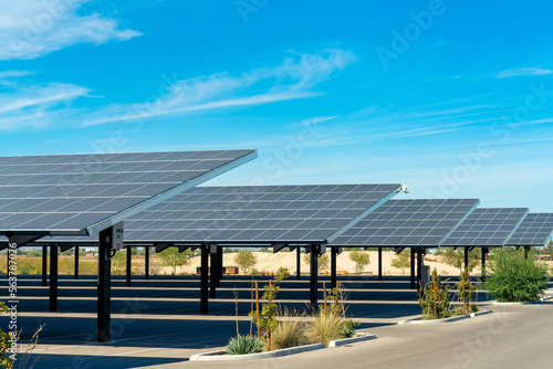 Solar pannels in rows in a parking lot or car park used as covering in the sweltering sun in Arizona