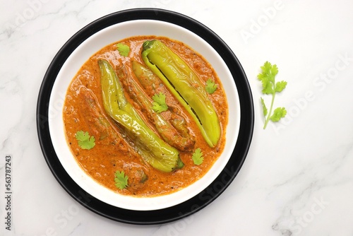 Mirchi or mirch ka Salan. Green chilly sabzi. It is a popular Indian chili and peanut curry from Hyderabad. Accompanies Hyderabadi mutton or chicken biryani. Copy space. 