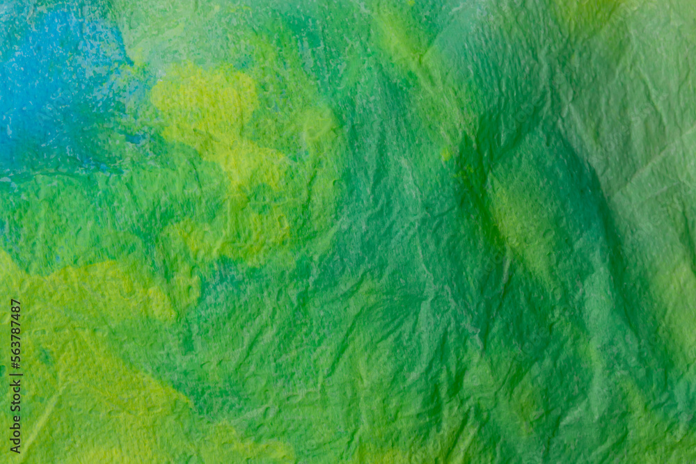 Background of crumpled green paper. Wrinkled paper close-up Background of crumpled green paper. Wrinkled paper close-up