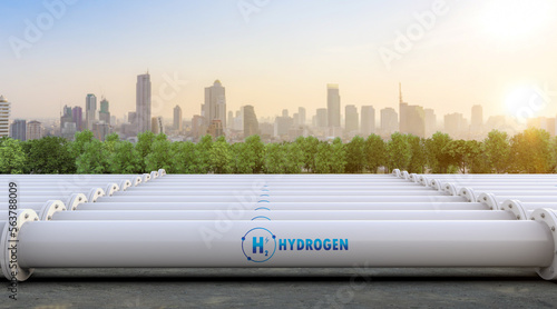 Photographie Metal pipeline with green field and blue sky background