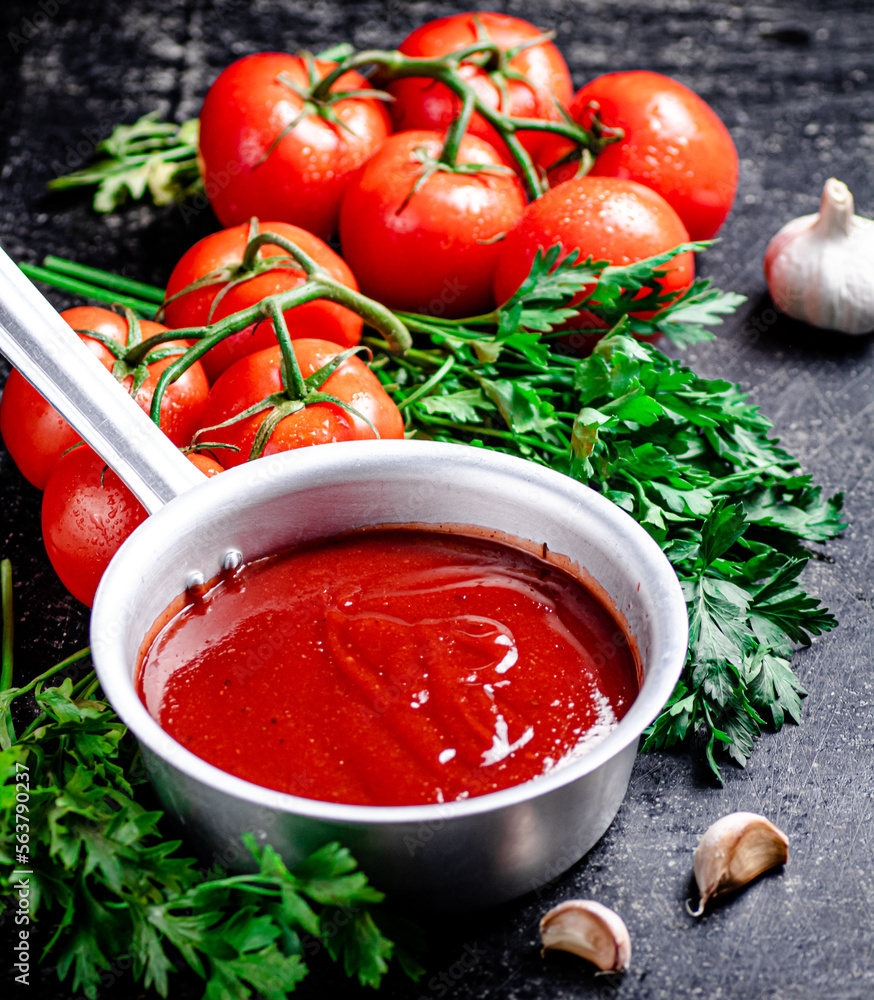 Tomato sauce in a sauce roll with parsley. Tomato sauce in a sauce roll with parsley.
