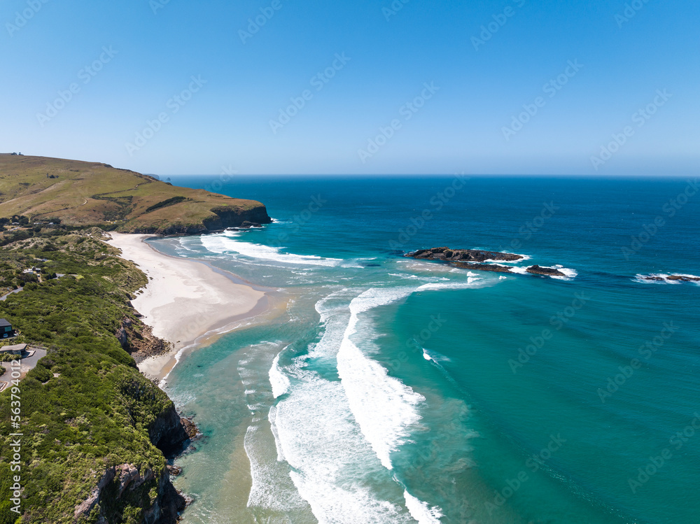 High angle aerial drone view of Smaills Beach and Bird Island near the Otago Peninsula to the east of Dunedin, the second-largest city in the South Island of New Zealand.