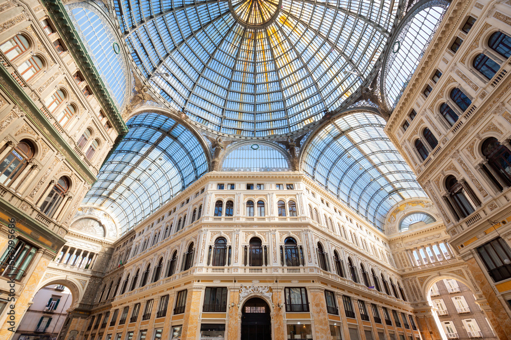 Historic public shopping gallery with old Architecture and Glass Arch Ceiling, Galleria Umberto I. Naples, Italy.