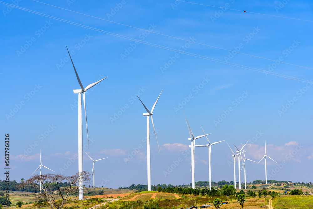 Windmills for clean electric power production. Windmill wind turbine for eco energy green and clean energy environment concervation climate change concept. Windmills for clean electric power production. Windmill wind turbine for eco energy green and clean energy environment concervation climate change concept.