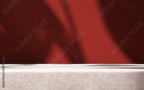 Foto Table countertop, rose pink velvet tablecloth in sunlight, tropical leaf shadow
