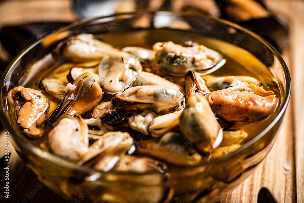 Fototapeta premium Pickled mussels in a glass bowl.