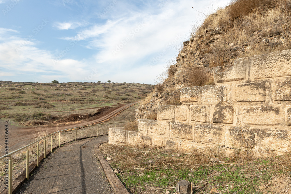 Road  passing by the ruins of the fortress wall of the Ateret fortress - Metzad Ateret - Qasr Atara - located next to the ford of the Jacob daughters on the Jordan River, in northern Israel