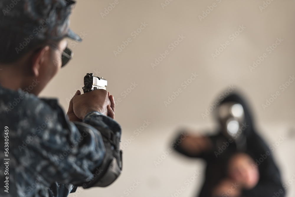 Fototapeta premium Police cop constable aiming handgun too attack terrorist thief robber with hostage in abandon building. Cop and bandit aim gun preparation too shoot.
