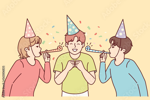 Teenage boy celebrating birthday with friends from school. Children in party hats and tongue whistle congratulating their peers on holiday standing among confetti. Flat vector illustration