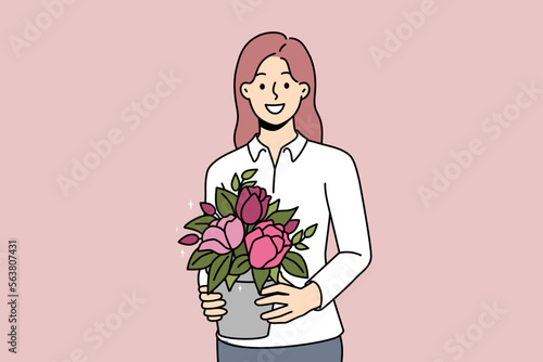 Smiling young woman with plant in hands. Happy female gardener or florist hold blooming houseplant. Flora and hobby concept. Vector illustration. 