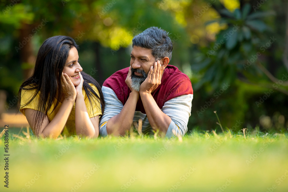 Young indian couple giving expression at park Young indian couple giving expression at park