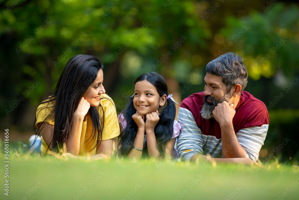 Happy indian couple with his little daughter at garden. Stock Photo ...