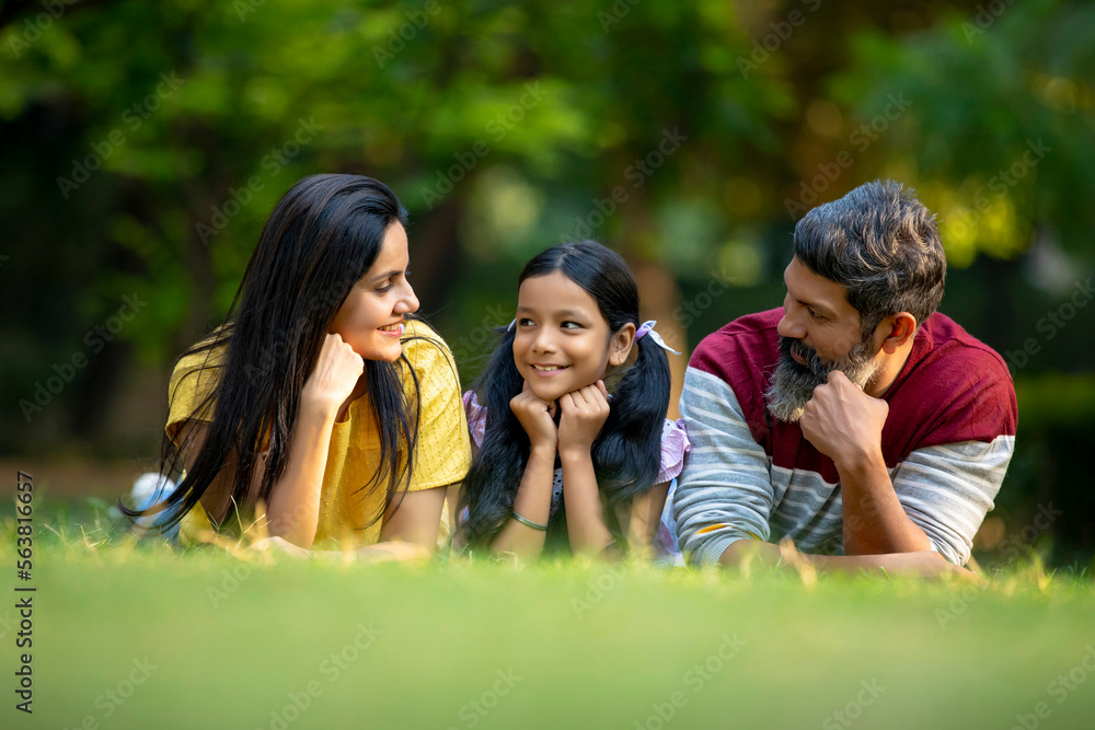 Happy indian couple with his little daughter at garden. Happy indian couple with his little daughter at garden.