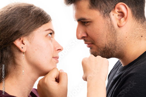 Couple arguing threatening with fists making angry expression