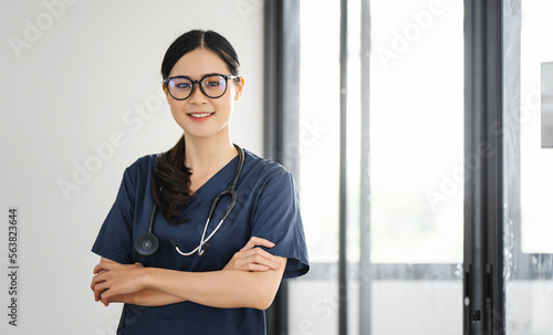 Free Download Portrait of happy doctor or nurse at hospital corridor - GFXLoad