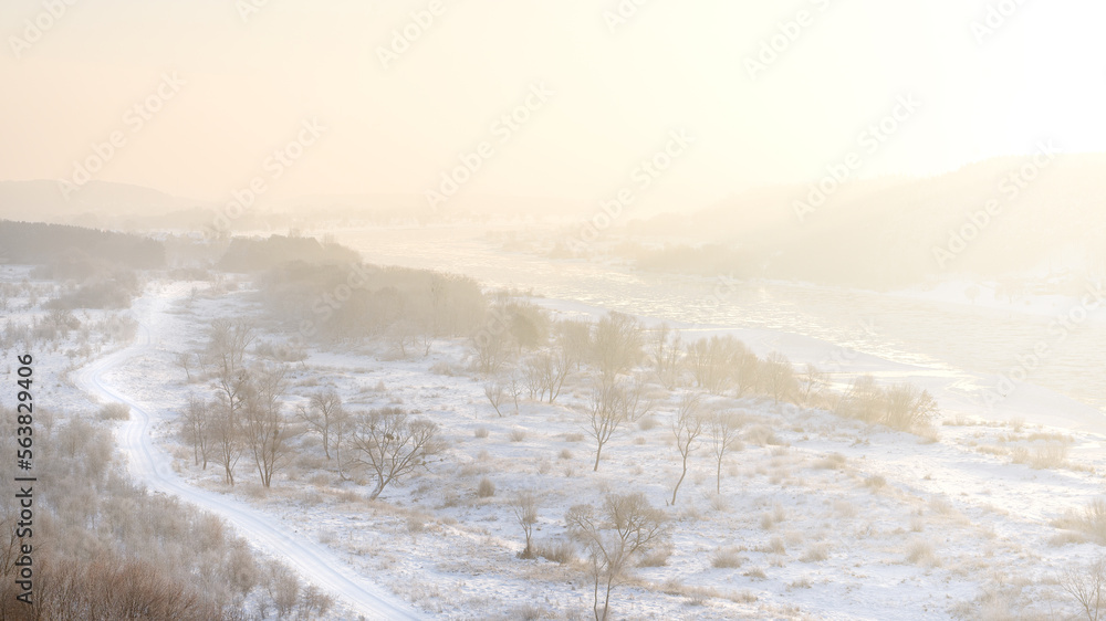 Amazing cold winter morning in Europe. Ice floes floating on a river. Amazing morning sunshine in extreme cold. Nemunas river in Lithuania. Wonderful views, frost, snow, ice stunning landscape.
