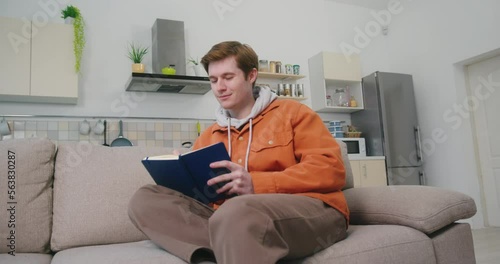 Young man writes detailed plan for video content on channel photo