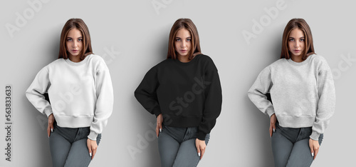 Mockup of white, black, heather crop sweatshirt on posing girl in jeans, front view, longsleeve isolated on background. photo