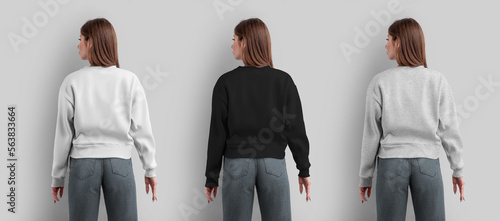 Mockup of a female sweatshirt, white, black, heather crop shirt on a slender girl in gray jeans, back view, for design, print.