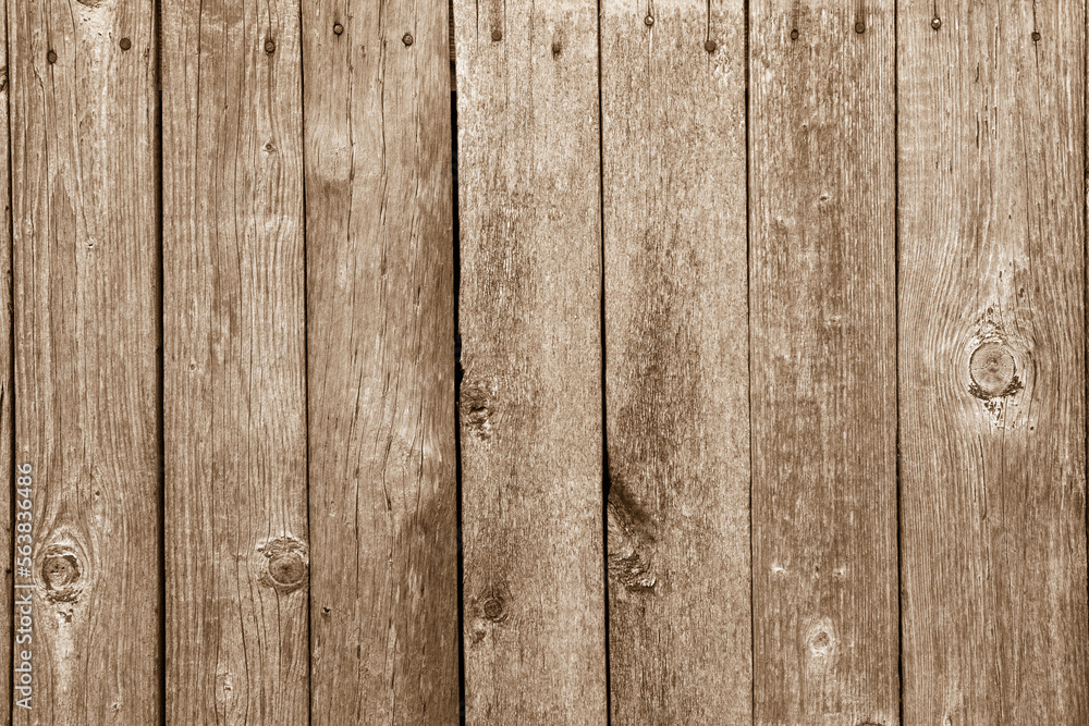 Naklejka premium Texture of brown wooden planks. Old wooden planks. Tinted image.