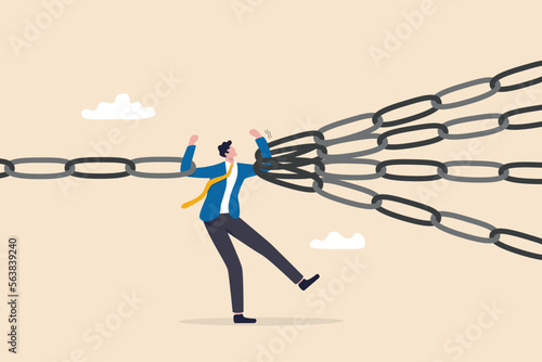 Single point of failure, risk or vulnerable weak point to make all system down, important point to hazard or beware danger concept, businessman at try so hard to hold multiple chain to avoid failure. photo