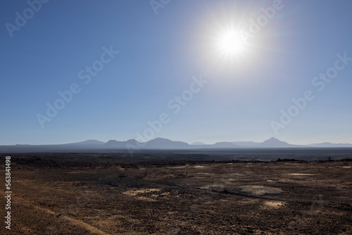 Views across the black lava volcano field of Jabal Qidr in the Harrat Khaybar region, north west Saudi Arabia photo