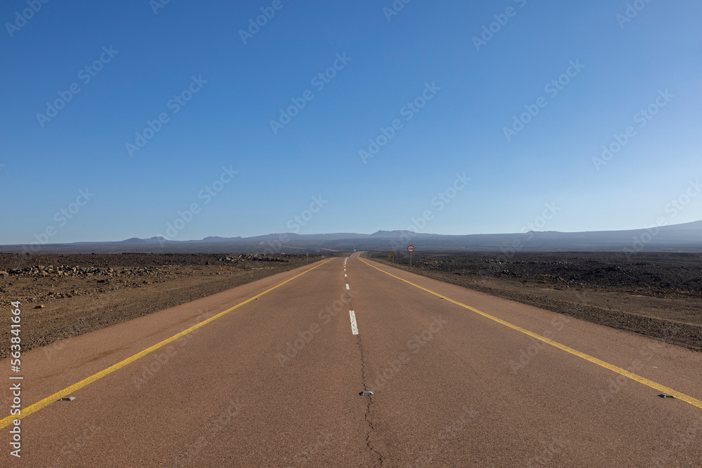 Desert road in remote rural area of Al Madinah in north western Saudi Arabia Desert road in remote rural area of Al Madinah in north western Saudi Arabia