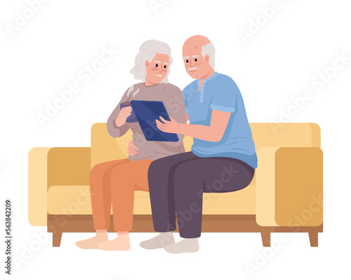Elderly couple using tablet together semi flat color vector characters. Editable figures. Full body people on white. Simple cartoon style illustration for web graphic design and animation