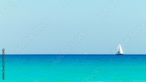 A boat in the turquoise waters of the Mediterranean Sea.