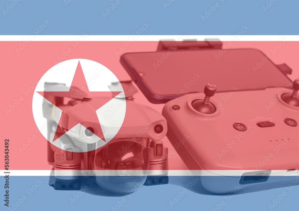 Obraz premium North Korea flag and quadcopter drone aerial camera