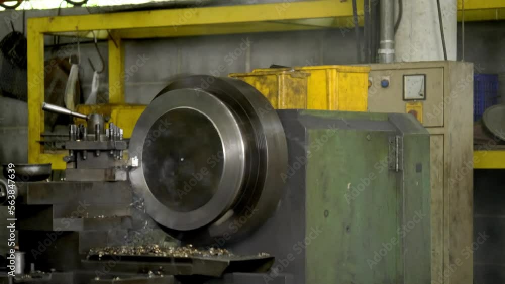 Machines are working to grind steel in an industrial factory. Machines are working to grind steel in an industrial factory.