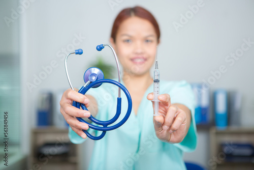 young woman doctor with syringe